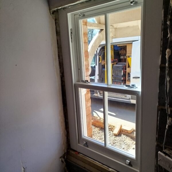 Timber sash window fitted in a deep reveal, Pirbright, Surrey